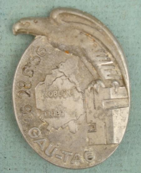 RARE EARLY 1936 GAU TAG BADGE FOR KOBLENZ-TRIER: THIS IS A LARGE, RARE, ORIGINAL GAU TAG BADGE FROM THE KOBLENZ-TRIER GAU. THE OVAL BADGE HAS A STYLEIZED EAGLE STANDING ON A SWASTIKA NEXT TO THE MAP OF GAU. 