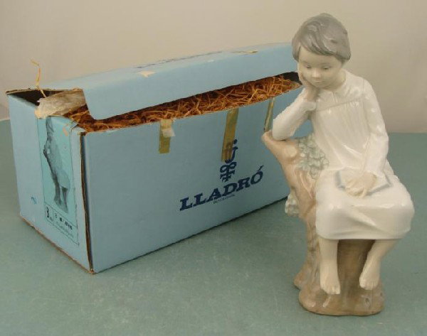 Lladro Sculpture Little Boy Thinking Pensador 4876 MIB: This Lladro sculpture portrays a thoughtful little boy immersed in a book. Name: Little Boy Thinking Spanish Name: Pequeno Pensador Item Number: 4876 Finish: Glazed Sculptor: Jose Roig Issued: 1974 Re
