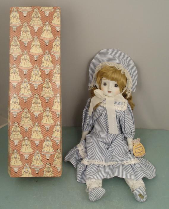 Mitzi 18 In. Porcelain Music Box Doll by Enesco MIB: This is "Mitzi," a Nostalgic Doll made by Enesco in 1982. She is also a music box, and when you wind the key on back you'll here the tune "A few of my Favorite Things." The doll has porcelain head and