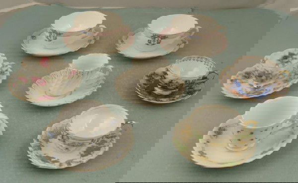 7 Teacups Noritake, Made in Occupied Japan MIJ: Here are 7 teacup and saucer sets, all made in Japan. They are all bone China, and date back 25 years or more. The cups range in size from 2 1/4" to 3 1/2". They have nicely detailed flowers, and gold