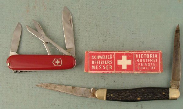 2 Vintage Folding Knives Swiss Army in Box, Camillus: Here are two vintage folding pocket knives. One is a classic Swiss Army knife, 3 1/4" long, with logo from Wild Heerbrugg, a Swiss optical instruments company. It is in excellent condition, and comes 
