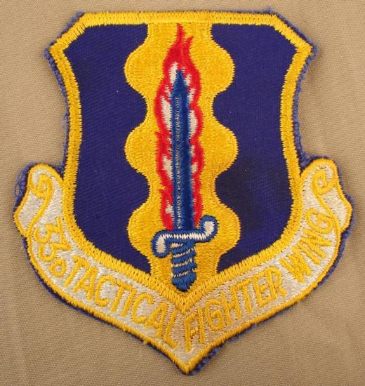 USAF Vietnam 33rd Tactical Fighter Squadron Patch: This is a Vietnam era patch from the 33rd Tactical Fighter Squadron. It features a great image of a flaming sword. It is theater made.Size: 2 5/8" x 3¼"Condition: Very good; a couple stains on