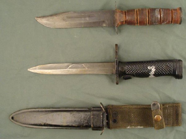 2 US MILITARY KNIVES-FIGHTING & US M6 BY MILPAR BAYONET: 2 MILITARY EDGED WEAPONS. ONE IS A USM6 BAYONET/KNIFE BY MILPAR W/SCABBARD (PAINTED BLACK WITH A SILVER BLOTCH FOR SOME REASON). BLADE LENGTH: 6", OVERALL LENGTH 10 3/4". THE OTHER IS A JAPANESE REPRO