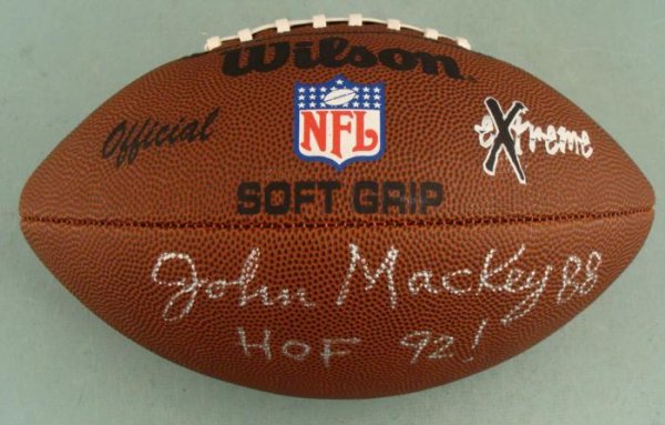 John Mackey HOF Signed NFL Football Balto Colts 1992: This football was signed by former Baltimore Colts tight end and Hall of Famer John Mackey. The autograph is in silver paint pen, and is highlighted with his jersey number 88, and HOF year 92! (with e
