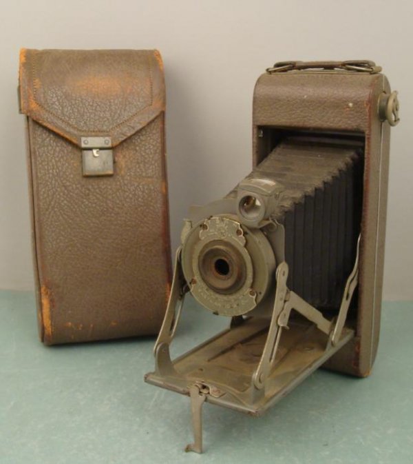 Kodak 1A 1910s WWI Olive Green Med Format Pocket Camera: This No. 1A Pocket Kodak is a series II with olive green body and case. We believe this camera was made in the early 1910's and used during WWI. No lens is present. It appears to be very clean, and in