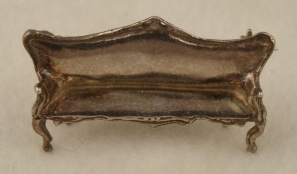 Sterling Silver Couch Pin Sofa Brooch: It is nice to sit on an elegant old sofa, but it is something special to wear one. This brooch is shaped just like a luxurious sofa, about 1 1/2" wide. It is solid sterling silver, and is 925 marked o