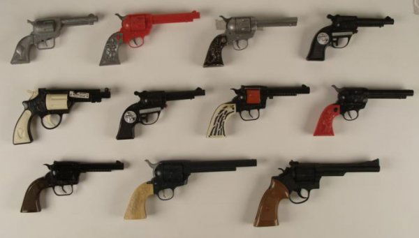 LOT 11 Antique Toy Guns Water and Cap Metal Plastic: This is a variety of 11 toy guns. They are in good condition overall, although a few do not work. There are 5 toy guns, 4 cap guns, and 2 water gun. The standouts include 2 with Quick Draw McGraw, one