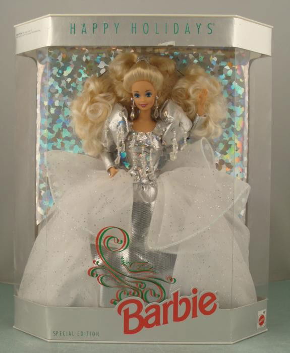 Happy Holidays Barbie 1992 Special Edition MIB NRFB: This is the Happy Holidays Special Edition Barbie doll from 1992. She is wearing a silver gown, with snowy white ruffles dotted with glitter. This Barbie is in Mint condition, having never been remove