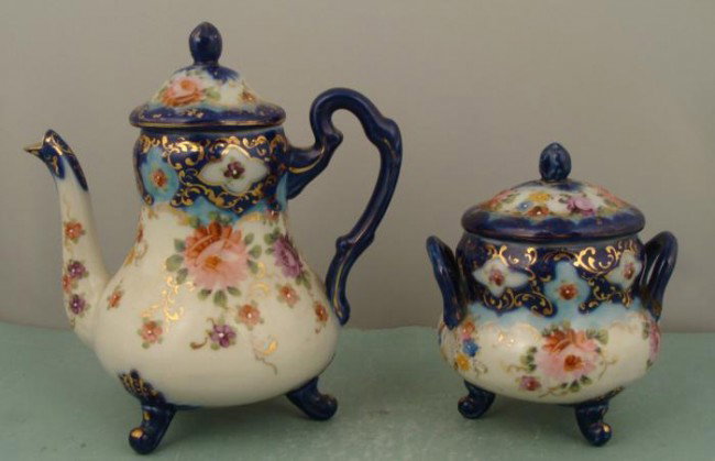 Vintage Poreclain European Transferware Teapot, Sugar: This teapot and sugar set has a colorful transferware floral pattern, with cobalt and gilt borders on white porcelain. There are no maker marks, but these are believed to European in origin, dating fr