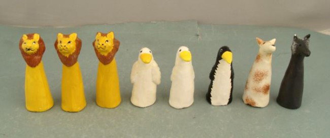 8 Poco A Poco Finger Puppet Animals Hand Made in Peru: These 8 charming animal figurines are also finger puppets. They were hand made in Peru for Poco a Poco of Berkeley California. There are 3 lions, 2 ducks, 1 dog, 1 wolf, and 1 penguin. The dog has a c