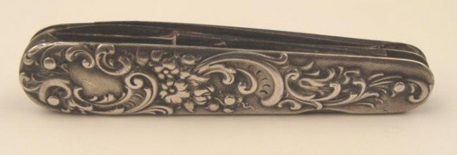 Sterling Silver Vintage Art Nouveau Foldng Pocket Knife: This vintage pocket knife has an elegant Art Deco style, with raised ornamentation, along with the initials ARL. It is sterling marked, with the number 241. The case is 2 3/4" long. One blade appears 