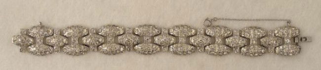 Art Deco Glittery Rhinestone Bracelet 12K GF: This Deco style rhinestone bracelet has a glittery look, on a chrome plated setting. The chain clasp is marked 12KT GF (gold filled). It measures 3/4" x 6 1/2" around. It is in excellent condition, wi