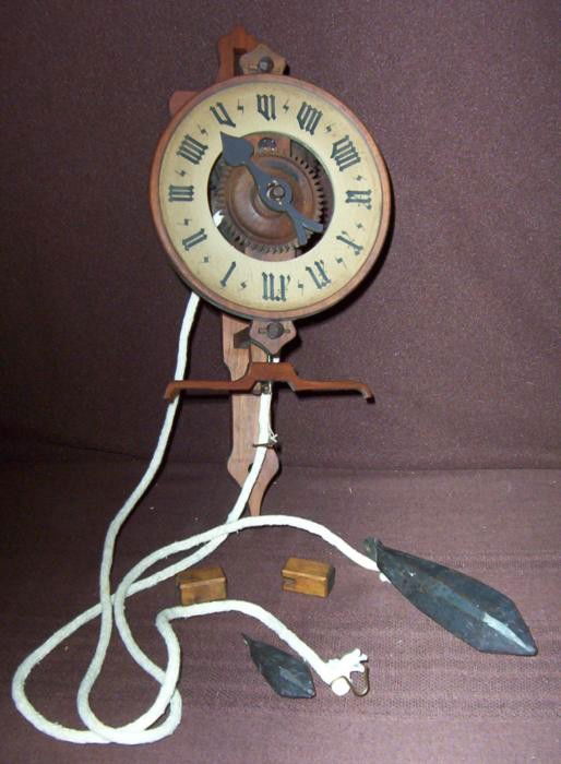 Bott Vintage Swiss Wooden Clock w/ Weight All Wood: All the parts on this vintage Swiss made clock are wooden, except for the weight which are metal. The side is signed "Bott," which we believe is the maker. This old style numerals are printed in black