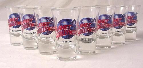 8 Planet Hollywood Shot Glass Boston Aspen Barcelona: This is a lot of 8 RARE shot glasses from Planet Hollywood. All are from closed locations! They are in mint, never used condition. Each 3½ tall flared glass features the blue globe and red lett