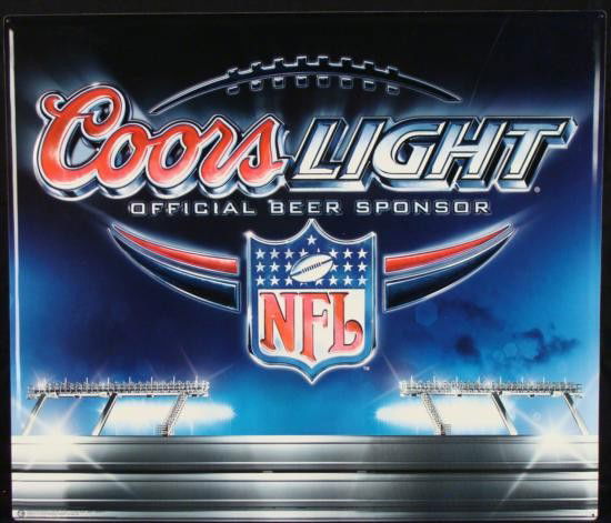 Coors Light NFL Logo Metal Tin Football Beer Bar Sign: Coors Light became a sponsor for the NFL, and they designed this metal beer sign with great big football logo in raised detail. There is a stadium in the background, glowing with lights. This sign cam