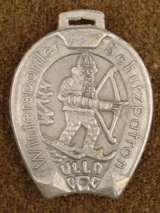 PRE-WWII WINTER SPORTS BOW SHOOTING MEDAL from BAYERN-H: SHOWS SANTA CLAUS TYPE FIGURE ON SKIS WITH BOW & ARROW