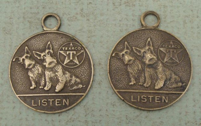 2 Texaco Dogs Medals Tags Listen- Metal Arts Co.: 2 Texaco Dogs Medals Size: 1" diameter Obverse: 2 Scottie dogs with their ears cocked, "LISTEN" and the Texaco oil company logo Reverse: Texaco