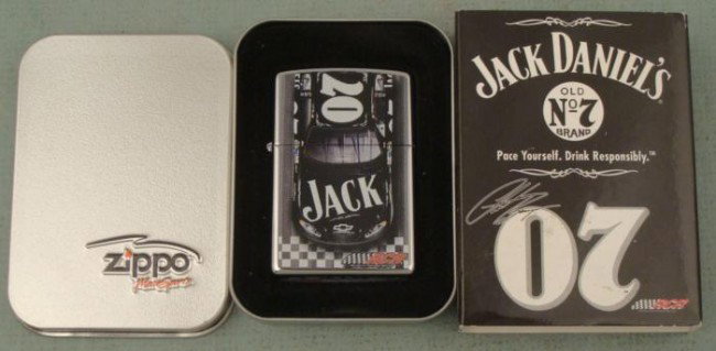 Zippo Jack Daniels NASCAR Racing Lighter New Mint MIT: This Zippo lighter has an exciting image of a Jack Daniels Chevy Camaro crossing the finish line. It is model 24231, Jack Daniels Finish Line. It is in Mint condition in the original tin and sleeve. T