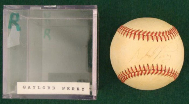 Gaylord Perry Signed Baseball MLB HOF, Ball Cube: This baseball was signed by Hall of Fame pitcher Gaylord Perry. The autograph is in black ballpoint, and it's a little light but still legible. The ball is a Rawlings Official American League Bobby Br