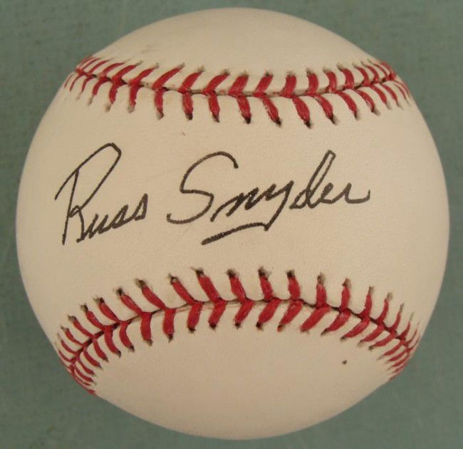 Russ Snyder Signed Baseball KC Athletics MLB Ball: This baseball was signed by former Major League outfielder Russ Snyder. The autograph is in black ballpoint. The ball is a Rawlings Official Major League Selig model. It is in excellent condition, wit