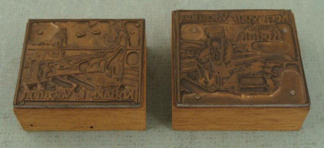 2 Kodak Camera Ad Copper Print Blocks Vacation 1920s: These two copper printers blocks were made for print advertisements for Kodak cameras. They touted the Kodak camera as a perfect thing to take on vacation. One has the line "Kodak for Vacation," and i