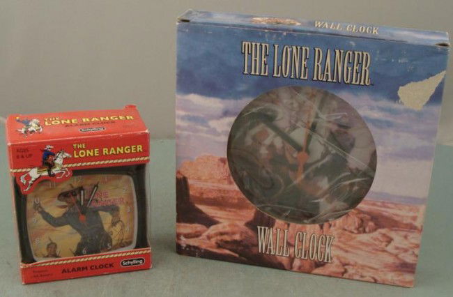 2 Lone Ranger Alarm, Wall Clocks Schylling MIB: These are two Lone Ranger clocks, both in Mint condition in the original boxes. First, wake up to the sound of bells on the Lone Ranger alarm clock, from Schylling. It is 4" x 4", and one AA battery i