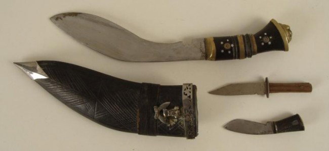 WWII ERA CBI BRINGBACK-KUKRI GURKAS OF INDIA-KNIFE: WWII ERA CBI BRINGBACK-KUKRI OF THE GURKAS OF INDIA-KNIFE IN SCABBARD WITH 2 SMALL KNIVES IN POUCH GURKA KNIFE WITH TOOLED LEATHER SCABBARD W/METAL FITTINGS & EMBLEM. FANCY LARGE KNIFE MARKED INDI