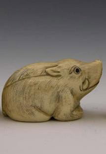 Signed Carved Ivory Netukes early 20th c of a boar: Signed Carved Ivory Netukes, early 20th c, of a boar, signed on the underside