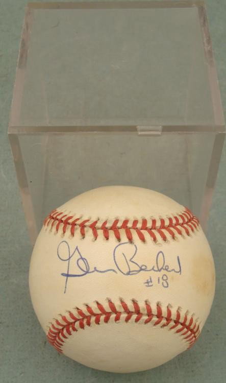 Glenn Beckert Signed Baseball Cubs w/ Cube: Former Cubs' second baseman Glenn Beckert signed this Leonard S. Coleman Jr. baseball in blue ballpoint, along with his uniform number #18. The ball is in good condition with some smudging, but the au