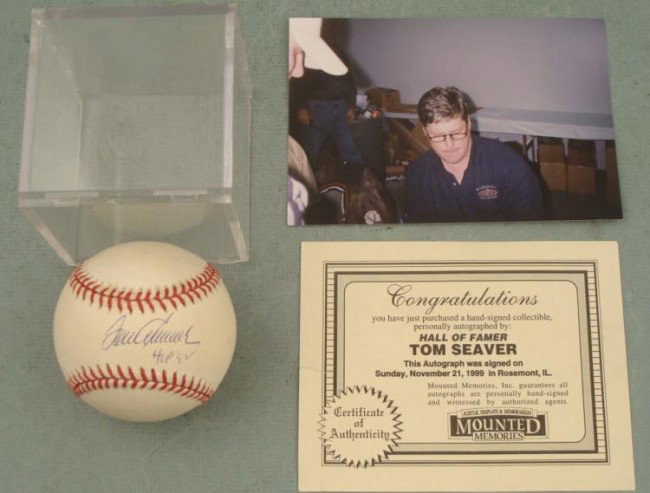 Tom Seaver Signed Baseball HOF w/ COA, Photo, Cube: One of baseball's all time great starting pitchers Tom Seaver signed this Leonard S. Coleman Jr. baseball in blue ballpoint, along with his Hall of Fame induction year '92. The ball is in excellent co