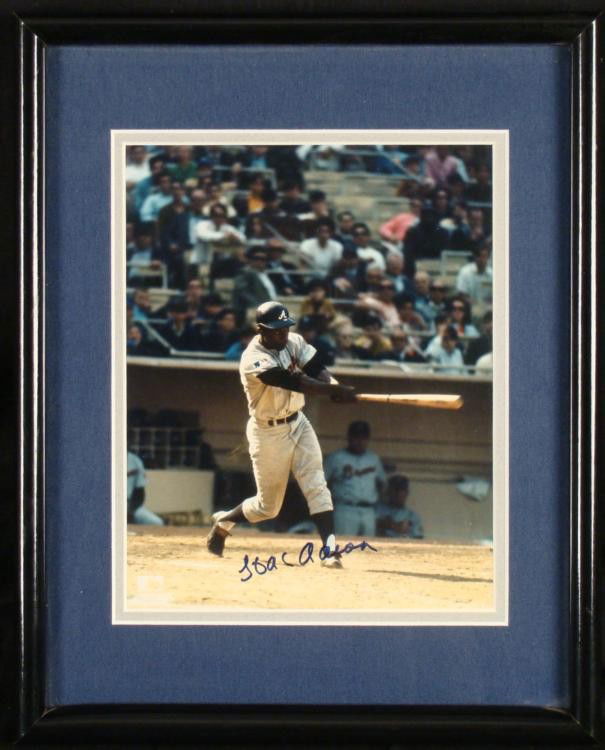 Hank Aaron Signed 8 x 10 Braves Photo Framed w/COA: This 8 x 10 photo was signed in blue Sharpie by the legendary Atlanta Braves Hall of Famer Hank Aaron. It is double matted in silver and blue, in a black laminate frame 12" x 15". It is in excel