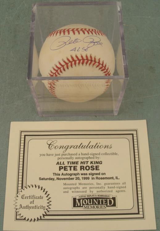 Pete Rose 4256 Signed Coleman Baseball w/ Cube, COA: All time Hit King Pete Rose signed this Leonard S. Coleman, Jr.Baseball in blue ballpoint, along with his number of hits 4256. The ball is in good condition, with some smudging. It comes in an acrylic