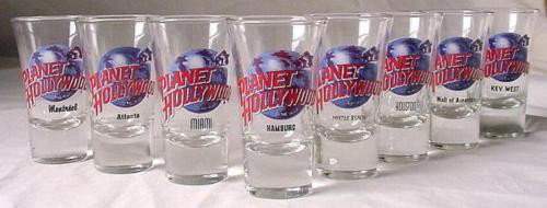 8 Diff. Planet Hollywood Original Shot Glass Hamburg: This is a lot of 8 RARE shot glasses from Planet Hollywood. All but two are from closed locations! They are in mint, never used condition. Each 3 1/2" tall flared glass features the blue globe and red