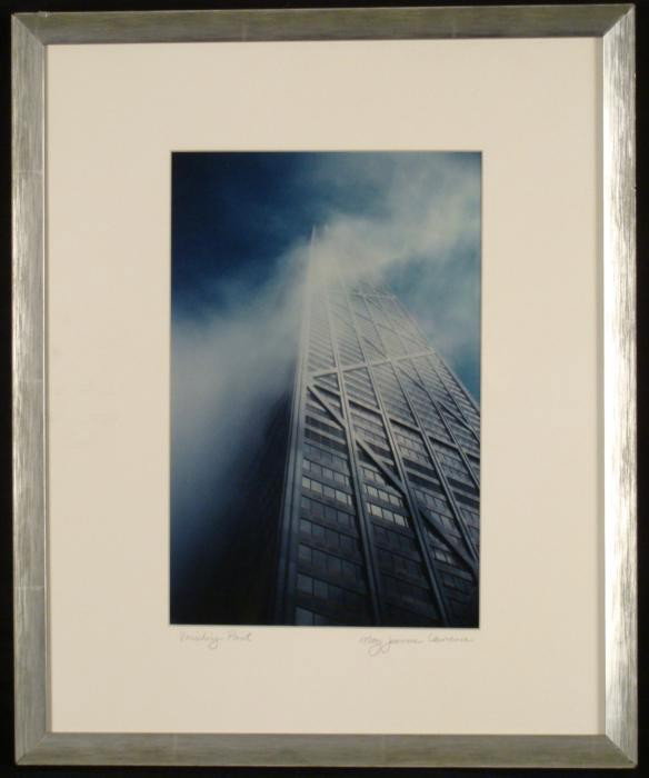 Mary Jeanne Lawrence Chicago John Hancock Photograph: This photograph shows the John Hancock Building in Chicago veering up into the clouds. Title: Vanishing Point Medium: Photograph Photographer: Mary Jeanne Lawrence Signature: Signed in pencil, lower r