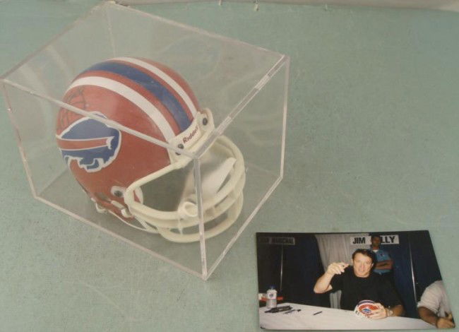 Autographed Buffalo Bills Jim Kelly Mini Helmet NFL: Offered here is a signed Jim Kelly Buffalo Bills mini helmet. It's by Riddell and Jim signed it in black sharpie, with his number above the Bills logo. The helmet comes with