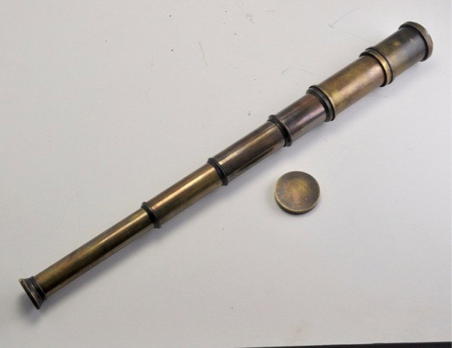 UNUSUAL maritime brass spyglass telescope 18in 4 fold: Antique maritime brass spyglass telescope 18in 4 fold. The functional 4 fold spyglass is made of brass. The extended height is 18 inch which collapses to a compact 6 inch. The Optics are fairly decent