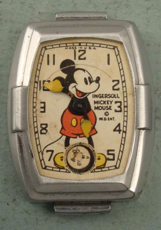 Ingersoll Vintage Mickey Mouse Watch for Parts, Repair: This is a Mickey Mouse wrist watch body, made by Ingersoll around the 1930s. The dial is white, with yellow hands Mickey, and W.D. ENT. copyright. The dial has concentric wear at the outer