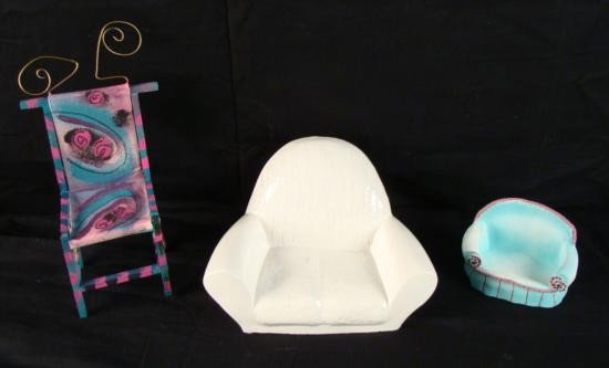 3 Artist Designed Mini Sofas Love Seats Furniture Art: Artist designed furniture is all the rage and we're not just talking oversized chairs. Here we have some under sized furniture! There is a white ceramic loveseat, or extra wide chair. The artist's