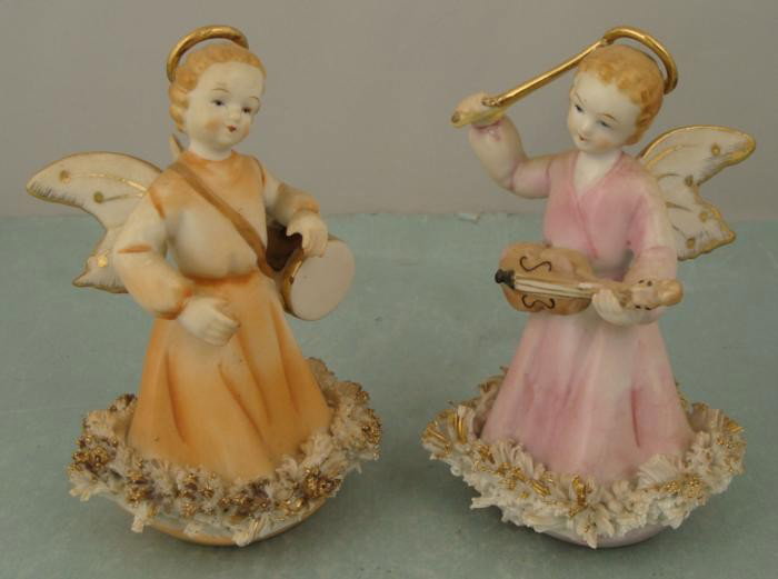 2 Vintage Ceramic Angel Figurines Playing Instruments: These two angel figurines look like they're ready to play a joyful song, one with a violin and one with a drum. These are 5" ceramic figurines, with delicate features, hand painted with gold highlight
