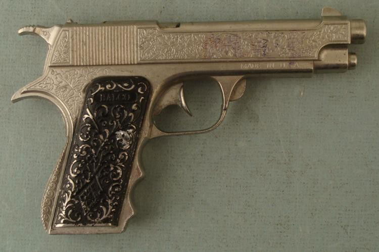 Halco 1950s Vintage Military Cap Gun Toy Pistol: This Halco cap gun is a "Military" model, marked so on the top of the grip, with the maker name on the opposite side. This all Diecast has a nice leaf design on the body, and tendril design on the bla