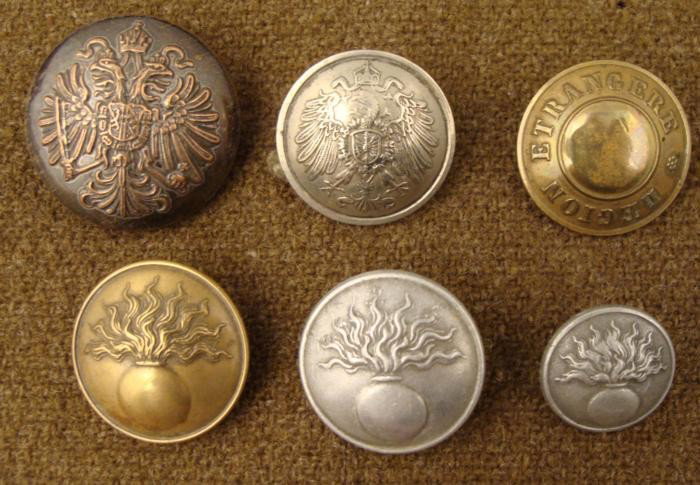 6 Austrian Antique Military Buttons Estate Collection: This a vintage group of 6 Austrian Military buttons. All buttons are different, and they include Legion Trangere, double eagle, and bomb designs. They range from very good to excellent condition. Thes