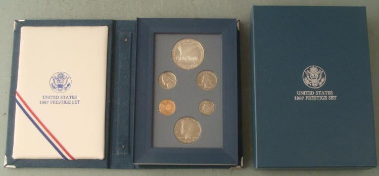 1987 US Constitution Prestige Set w/Silver Dollar: 1987 US Mint Constitution Prestige Set * Includes: 6 coins, including 1 silver dollar commemorating the 200th Anniversary of the Constitution; in fold-open display case Condition: Uncirculated, in ori