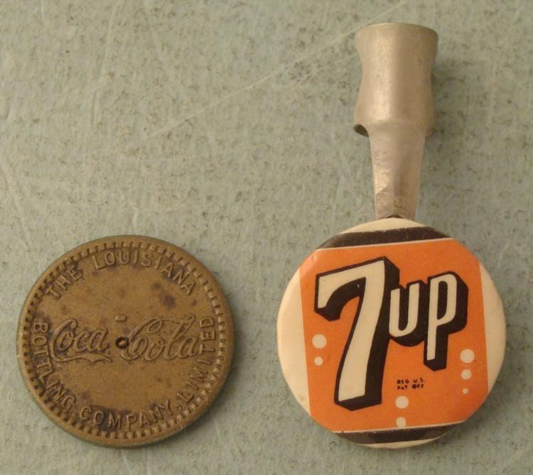 Coca-Cola New Orleans Token & 7up Pen Clip Vintage: Here are two vintage soda advertising pieces, both in very good condition. Coca-Cola penny-sized token from the Louisiana Bottle Company Limited 7up pen clip