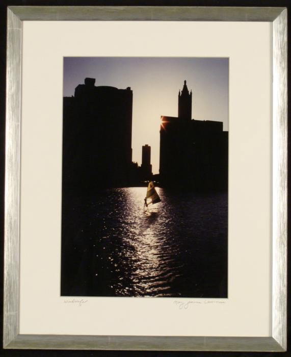 Mary Jeanne Lawrence Chicago Windsurfer Photograph Frmd: This photograph shows the Chicago River in the evening, with an unexpected sight- a windsurfer on the water. * Title: Windsurfer Medium: Photograph Photographer: Mary Jeanne Lawrence Signature: Signed