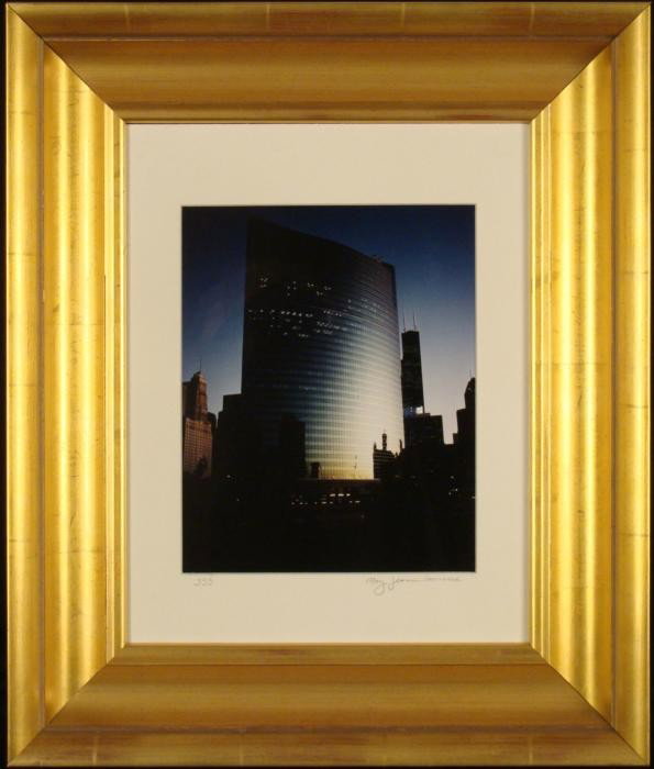 Mary Jeanne Lawrence Chicago 333 Wacker Frmd Photograph: This photograph shows sunlight hitting the curved glass fa ade of the familiar Chicago building at 333 Wacker Drive. Title: 333 Medium: Photograph Photographer: Mary Jeanne Lawrence Signature: Signed 