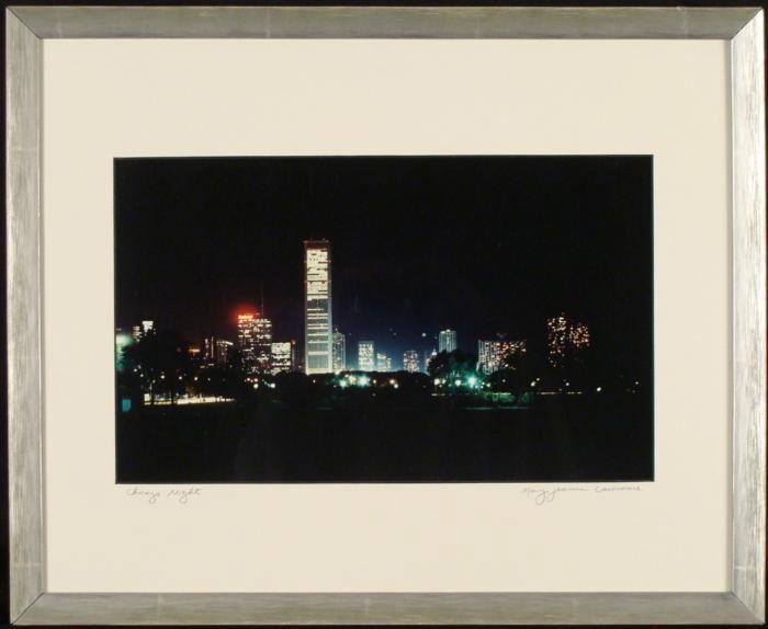 Mary Jeanne Lawrence Chicago Skyline Photograph Framed: This photograph shows the Chicago skyline at night, from years ago, with lights from the buildings and the lakefront. * Title: Chicago Night Medium: Photograph Photographer: Mary Jeanne Lawrence Signa