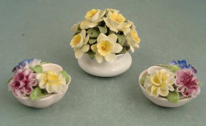 3 Vintage English Aristocrat Florals Porcelain Flowers: These Aristocrat Florals from England have delicate petals that remind us of Capodimonte. They are in very good condition, with no chips that we could find. Two are porcelain candle holders. Their hey