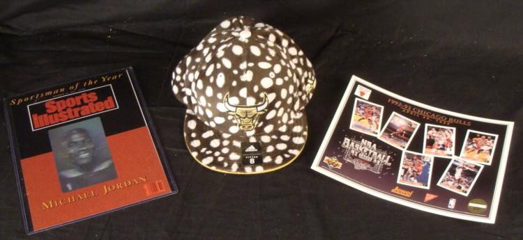 Chicago Bulls Lot Cow Hat Cap, SI Jordan Cover, Cards: Here are some great Chicago Bulls items. One is an Addidas fitted Chicago Bulls cap with white spots on fuzzy brown, kind of resembling a cow. The size is 8, and it is in mint condition with original 