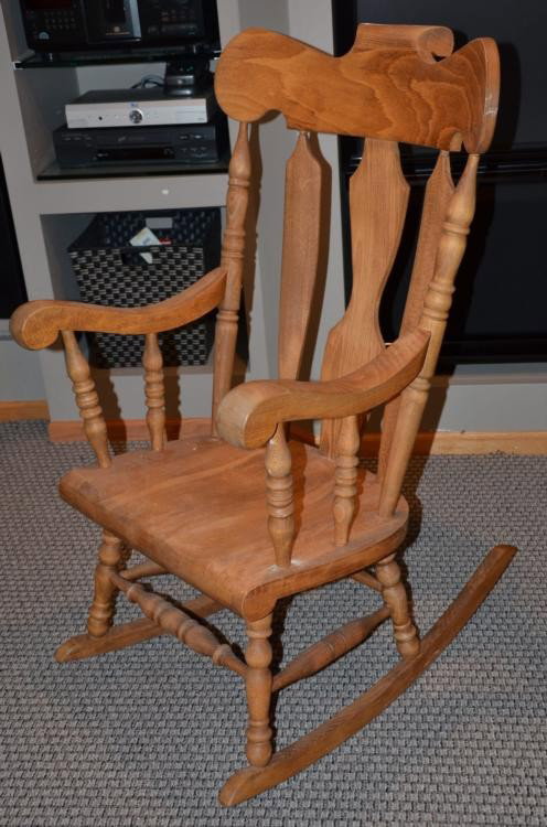 Classic Tall Wooden Rocking Chair Rocker Yugoslavia: This is an Eastern European wooden rocking chair, made in Yugoslavia in a classic style with tall back, spindles, and rounded head rest. The wood has a nice grain to it. The dimensions are: 19" x 21 1