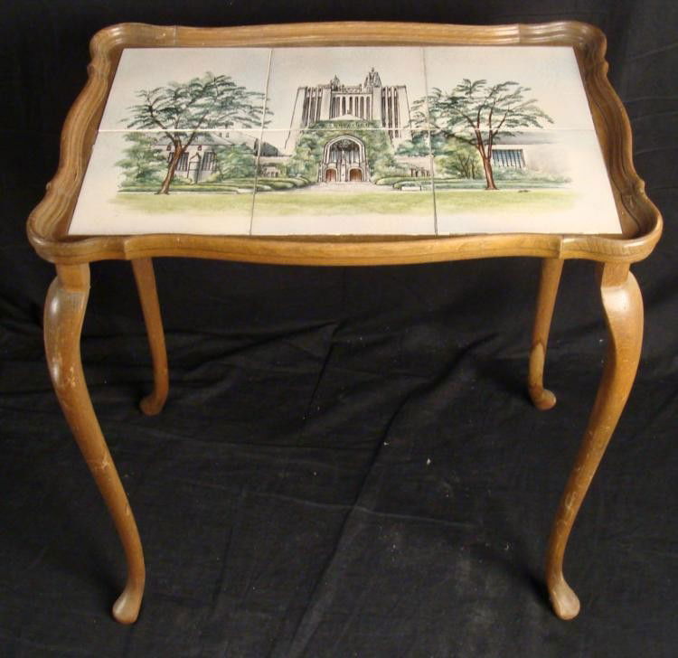 Table with Hand Painted Tile Top w/ Building: This table has a tile top, hand painted the image of a large building, probably a school or government building. * * Condition: Very Good Size: 20" x 14" x 22" There is a picture of a building on the